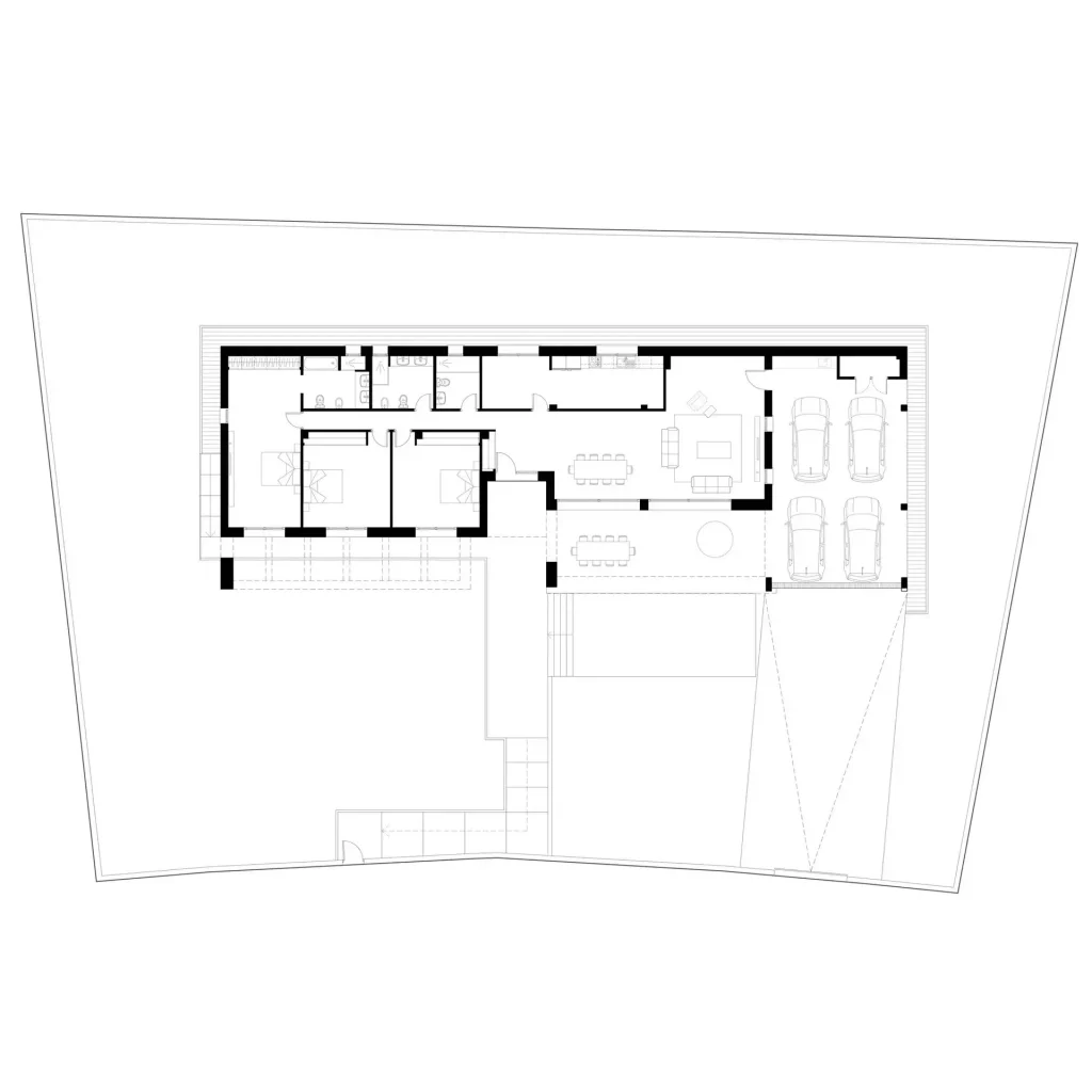 Floor plan of Villa L26 in La Moraleja: an L-shaped single-storey house with bedrooms, living and dining room and a four-car garage.